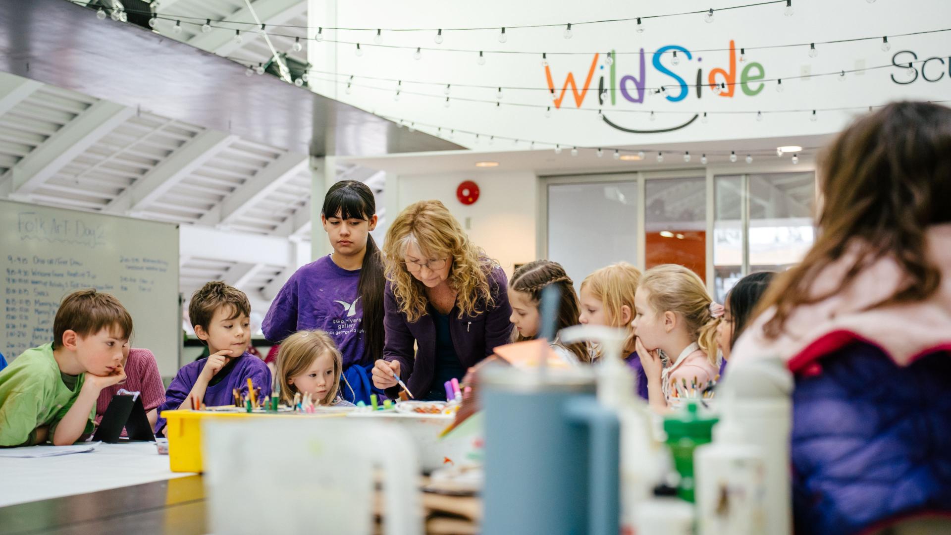 Kids doing arts and crafts at Two Rivers Gallery