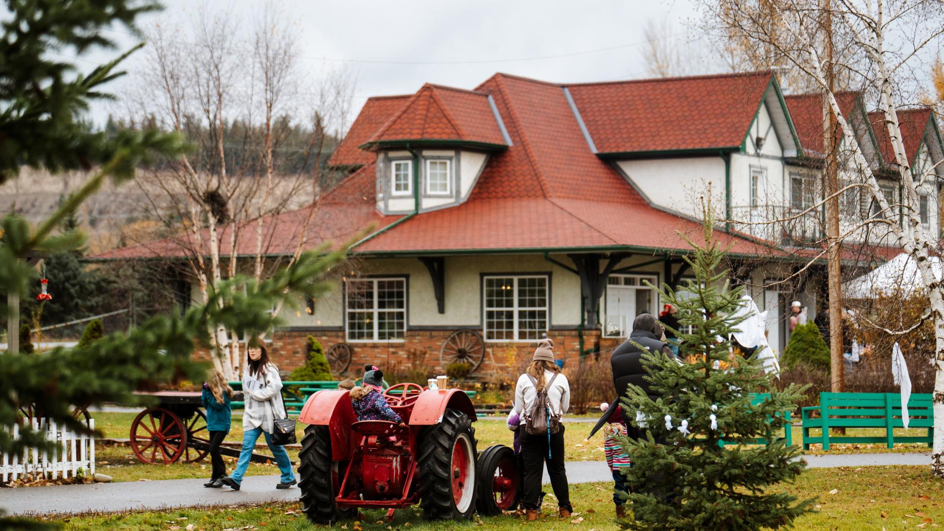 A family walks past the Central BC Railway and Forestry Museum