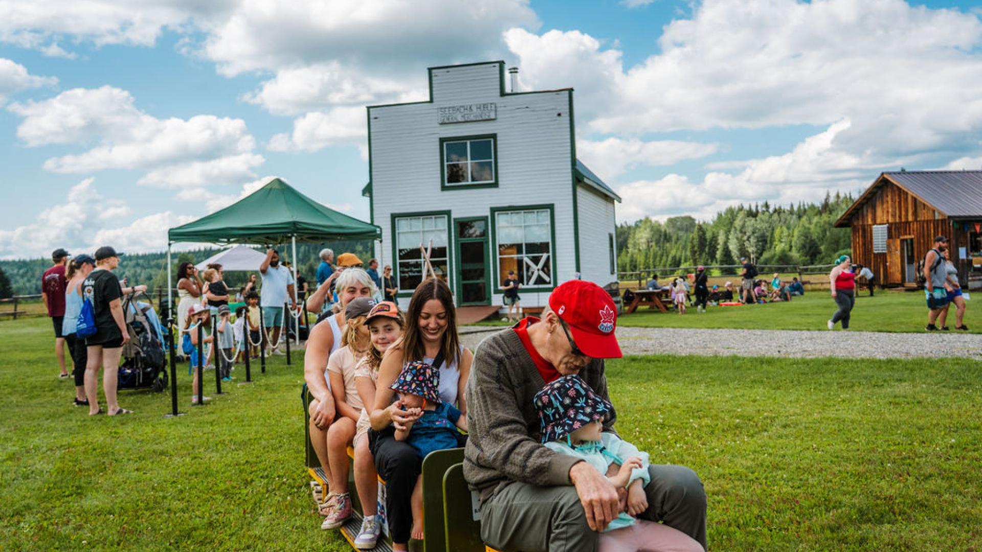 Guests ride the Railway Museum's Cottonwood Minirail at Huble Homestead's Kids Carnival