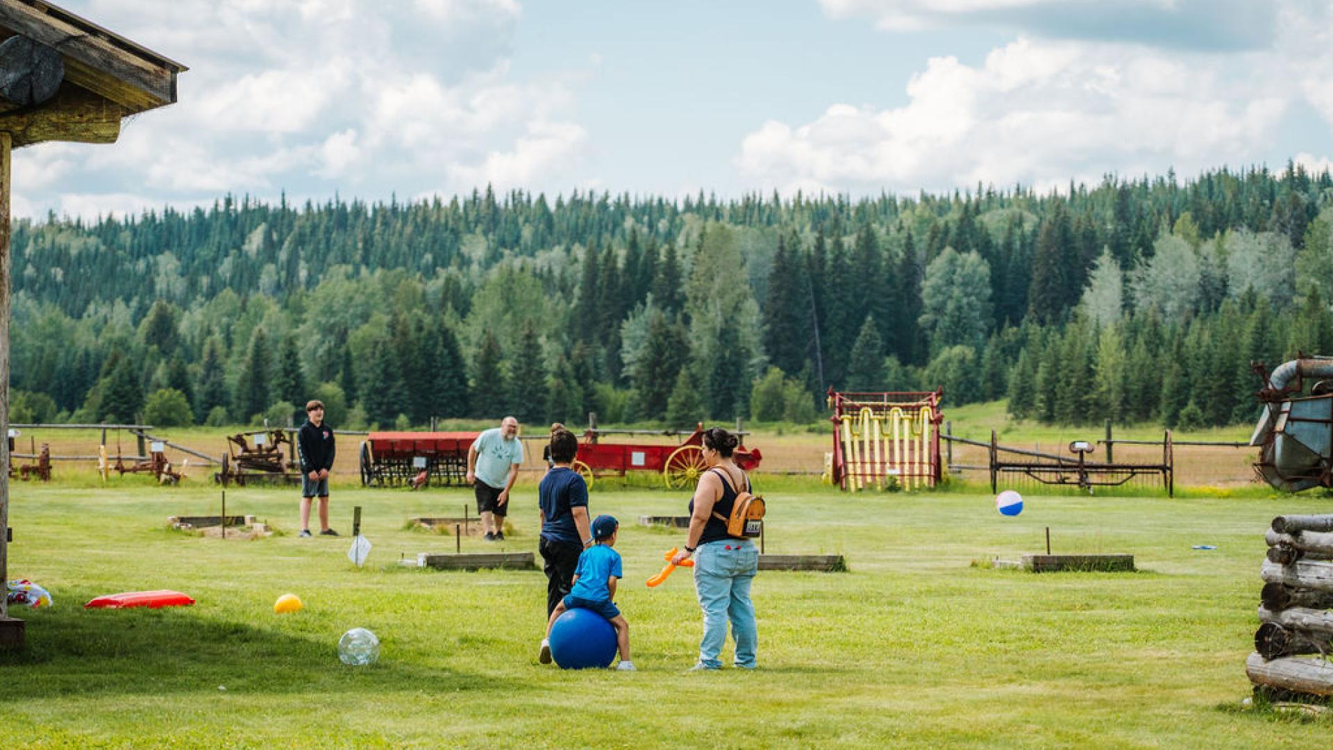 A family enjoys the Huble Homestead grounds