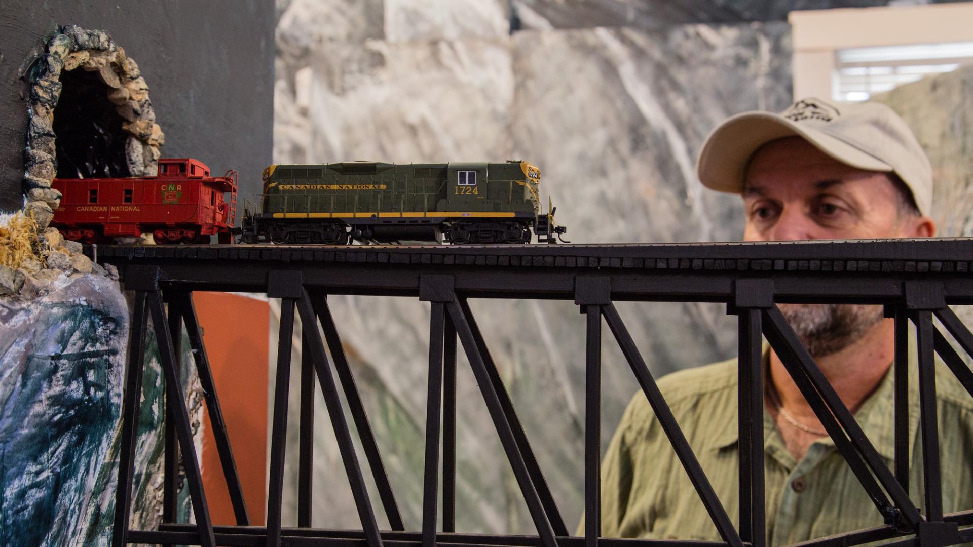 A man views the model train at the Valemount Museum