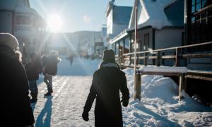 A woman walks down Barkerville's main street in winter