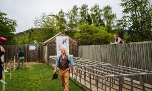 Interpreters prepare a crowd for a chicken race at the Fort St. James National Historic Site