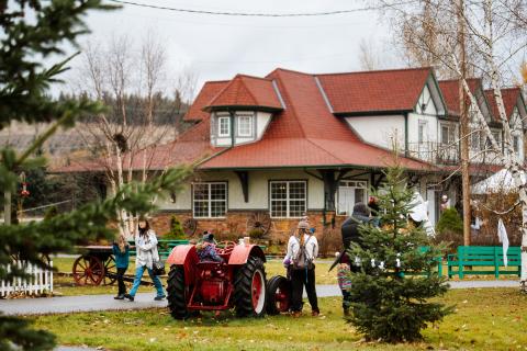 A family walks past the Central BC Railway and Forestry Museum