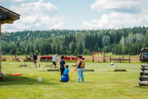 A family enjoys the Huble Homestead grounds